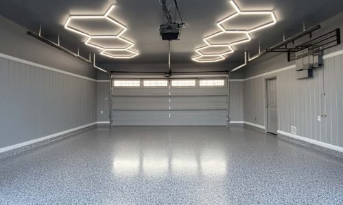 Garage epoxy floors with hex lights. polyaspartic top coat